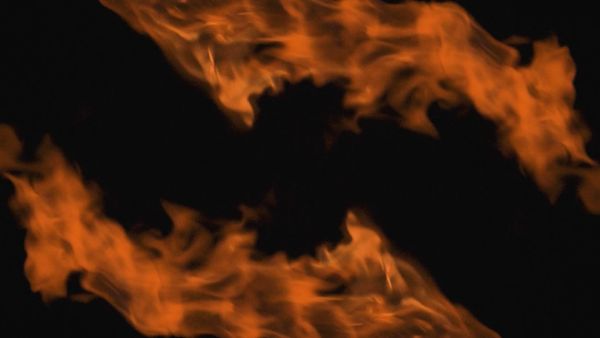 Two orange flames on black background